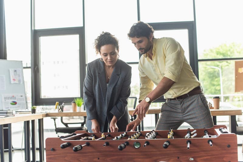 businessman pointing at table football