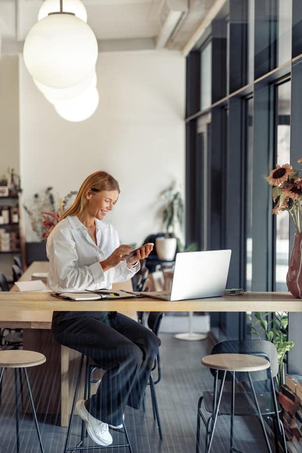 smiling business woman working on laptop