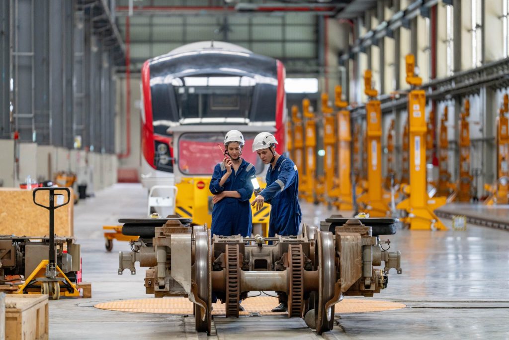 engineers inspecting locomotive in railway enginee 2024 06 05 17 39 23 utc scaled 1