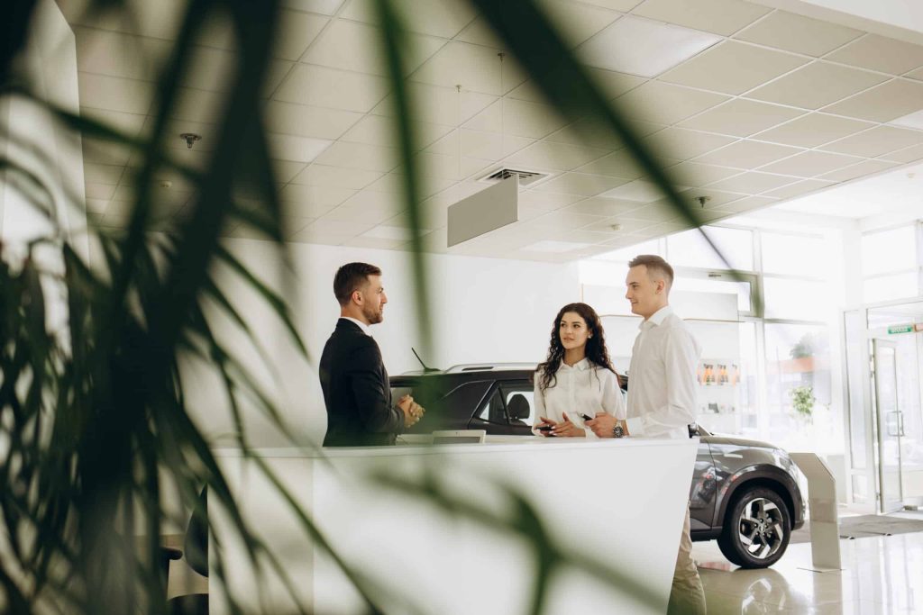 middle age couple choosing and buying car at car s 2023 11 27 05 10 17 utc scaled 1